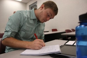 Student, Collin, prepares for the new honors society. Photo by: Hannah Covington