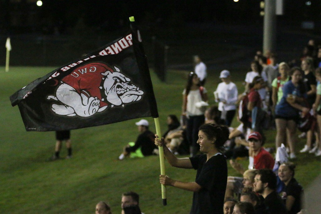 A student waves the Gardner-Webb flag in support of the team.