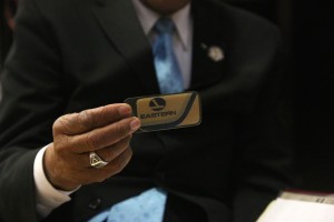 Brinson shows his badge from his time working with Eastern Airlines as a flight attendant. Photo by Megan Hartman