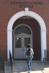 A student walks the ramp to enter into the Communication Studies Hall. Photo by Megan Hartman