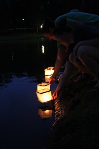 Taylor Schwartz and Giorgie Graves release their lanterns on the lake. Photo by Elizabeth Banfield