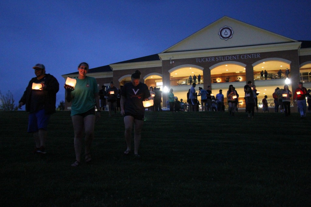 Seniors walk from Tucker to the Lake with their lit lanterns, reflecting on their time at Gardner-Webb as they prepare to release their lanterns on the lake. Photo by Elizabeth Banfield